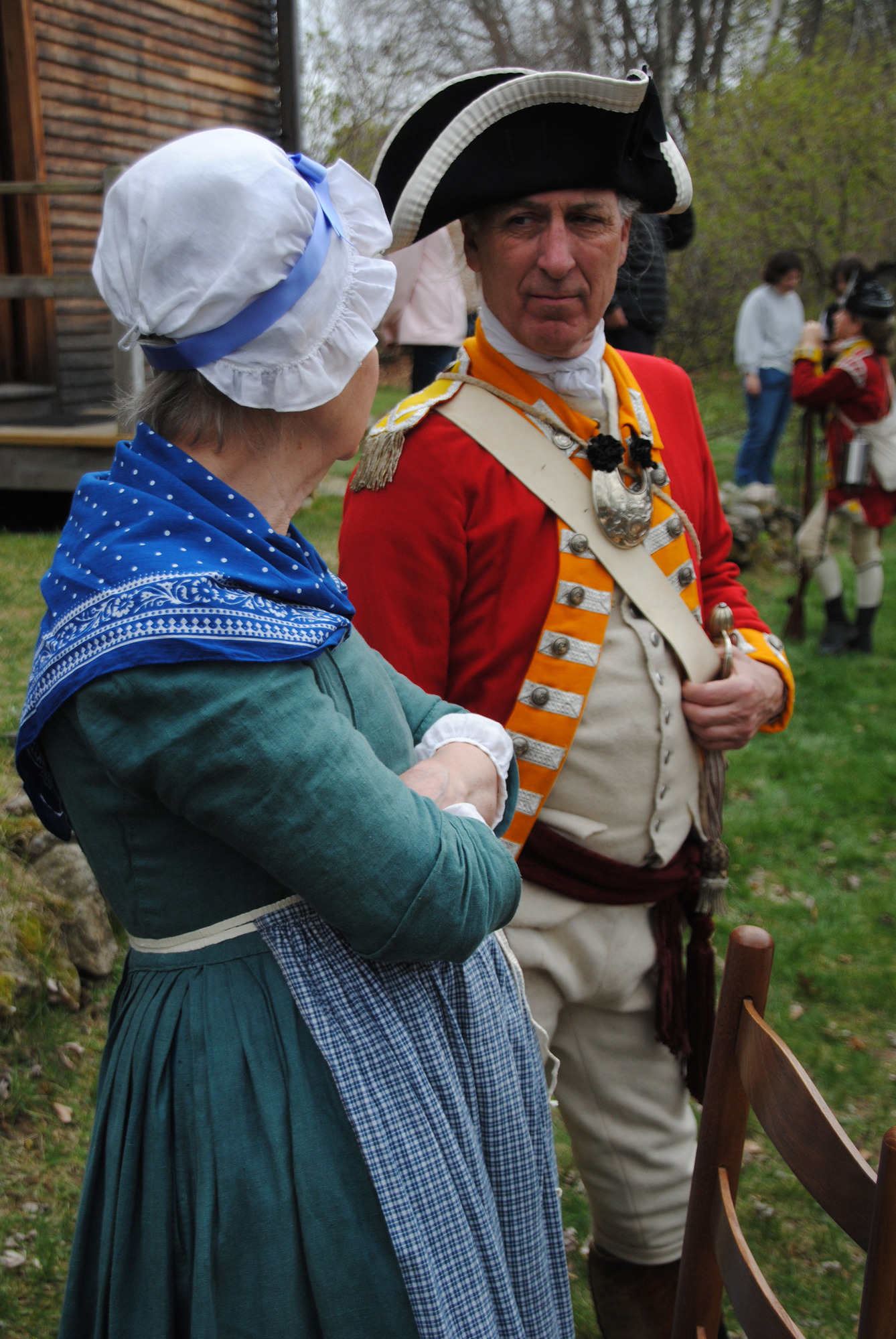 British officer talking with Mrs. Barrett 