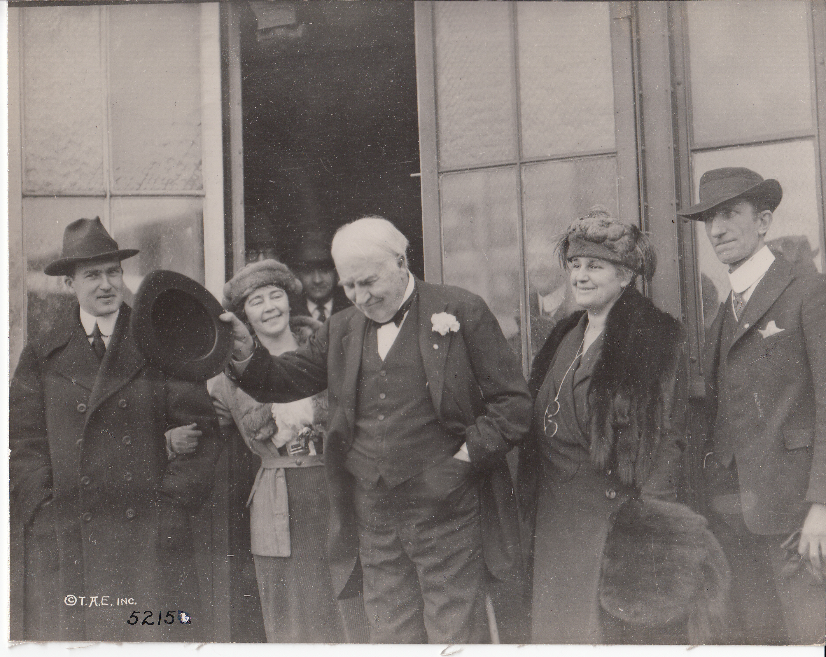 Thomas Edison in doorway of Building 5, with Charles Edison, Carolyn Edison, Mina Edison, and Thomas Edison, Jr., on Thomas Edison's 73rd birthday.