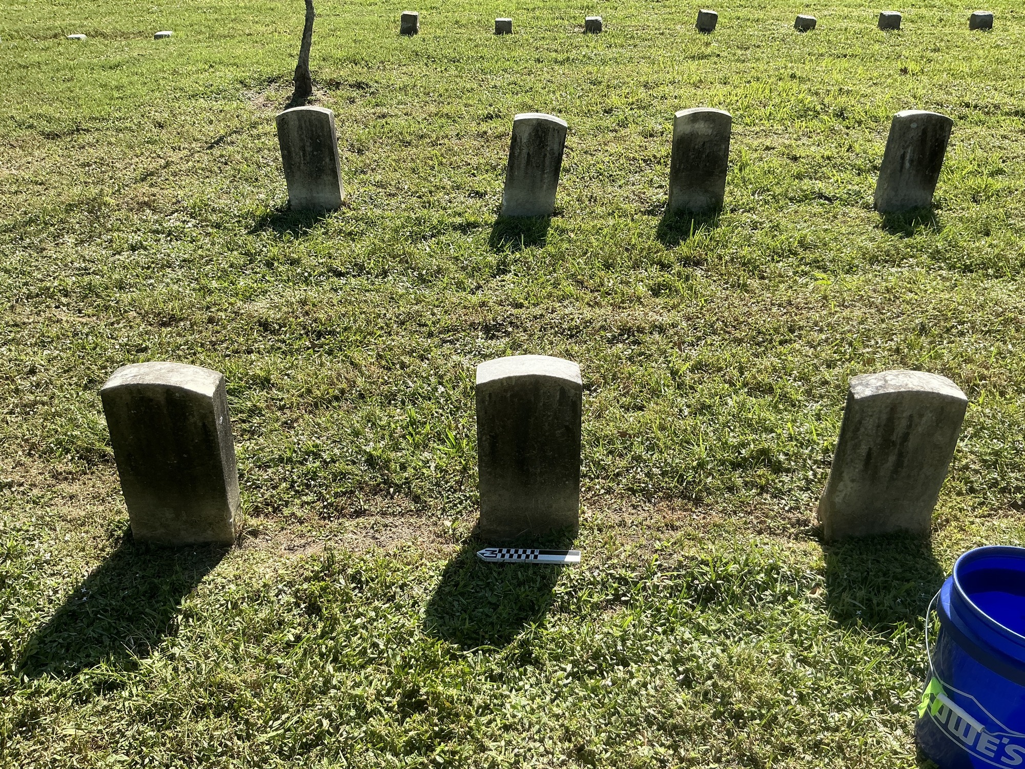 Extra image of historic upright marble headstone with recessed shield face.