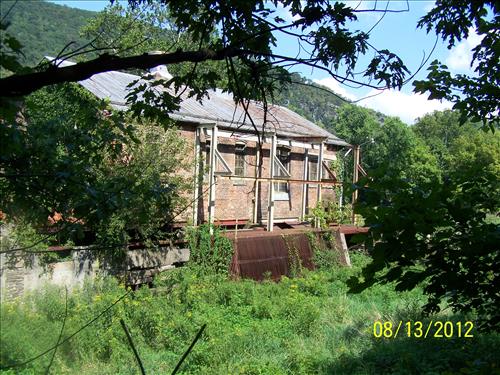 Photograph views of the historic Hydroelectric Plant building on August 13, 2012, which show the deteriorating exterior conditions which justify the project stabilzation work; Harpers Ferry National Historical Park/NPS.