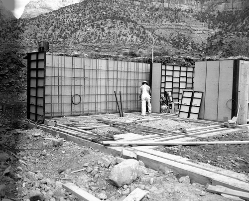 Placing wall forms, northwest corner of equipment room, forms and steel in place at Mission 66 Visitor Center and Museum construction.