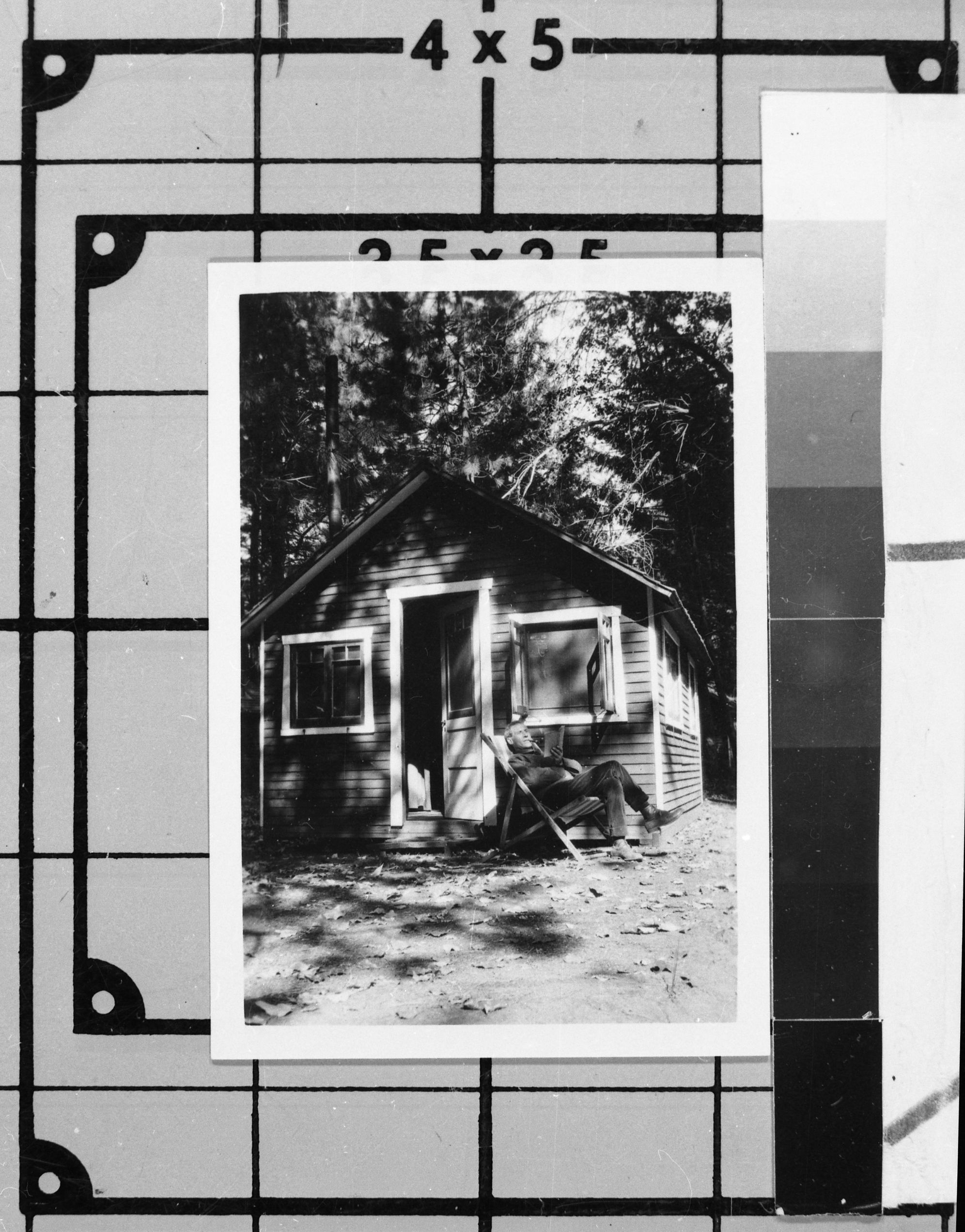 Oscar Lehman (?) in front of wood cabin with out bath at Yosemite Lodge. Photo donated by Audrey Harris. See also Y.N.P. Co. binders - 1923.