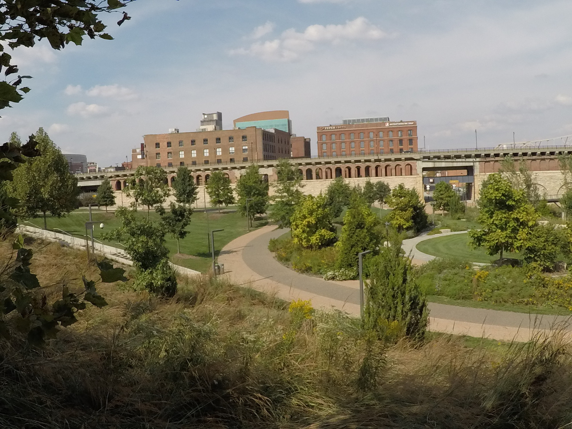 Sidewalk wind around in the grassy areas of the North Gateway on the Arch grounds.
