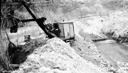 Soil and moisture control revetments, with steam shovel perched on bank of Virgin River.