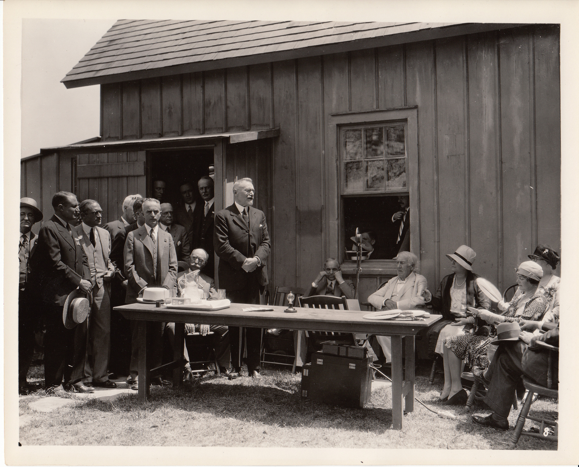 Presentation of Glass House to Henry Ford, left to right, John W. Lieb, Henry Ford, Thomas Edison, Mina Edison, Carolyn Edison with fan.