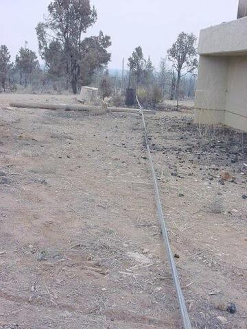 Fire damage to the water tank structure from the Long Mesa Fire, Mesa Verde National Park, July-August 2002