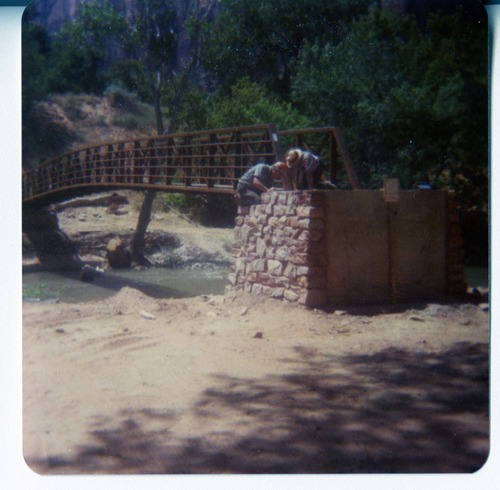 Men working on the emplacement of the new Zion Lodge footbridge.