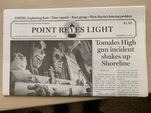 A photo of the front page of the October 25, 2018, edition of the Point Reyes Light. Text above the banner includes the words “Time Capsule,” indicating one of the articles inside is about the discovery of a time capsule placed in the Point Reyes Lighthouse on August 15, 1929, by Chief Lighthouse Keeper Gerhardt Jaehne and second assistant H.W. Miller. The time capsule was uncovered during the 2018 restoration project in early October 2018. The above the fold headline is "Tomales High gun incident shakes up Shoreline." A large photo on the left shows someone on a ladder putting up Dia de los Muertos decorations.