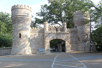 A large entrance gate that looks like a castle with two turrets. 