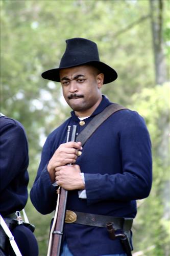Portaits of Civil War interpreters of U.S. Colored Troops with their rifles at Stones River National Battlefield, April 2004