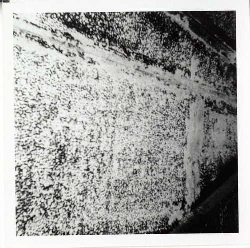 The interior of the 40000 gallon water tank showing buildup/corrosion.