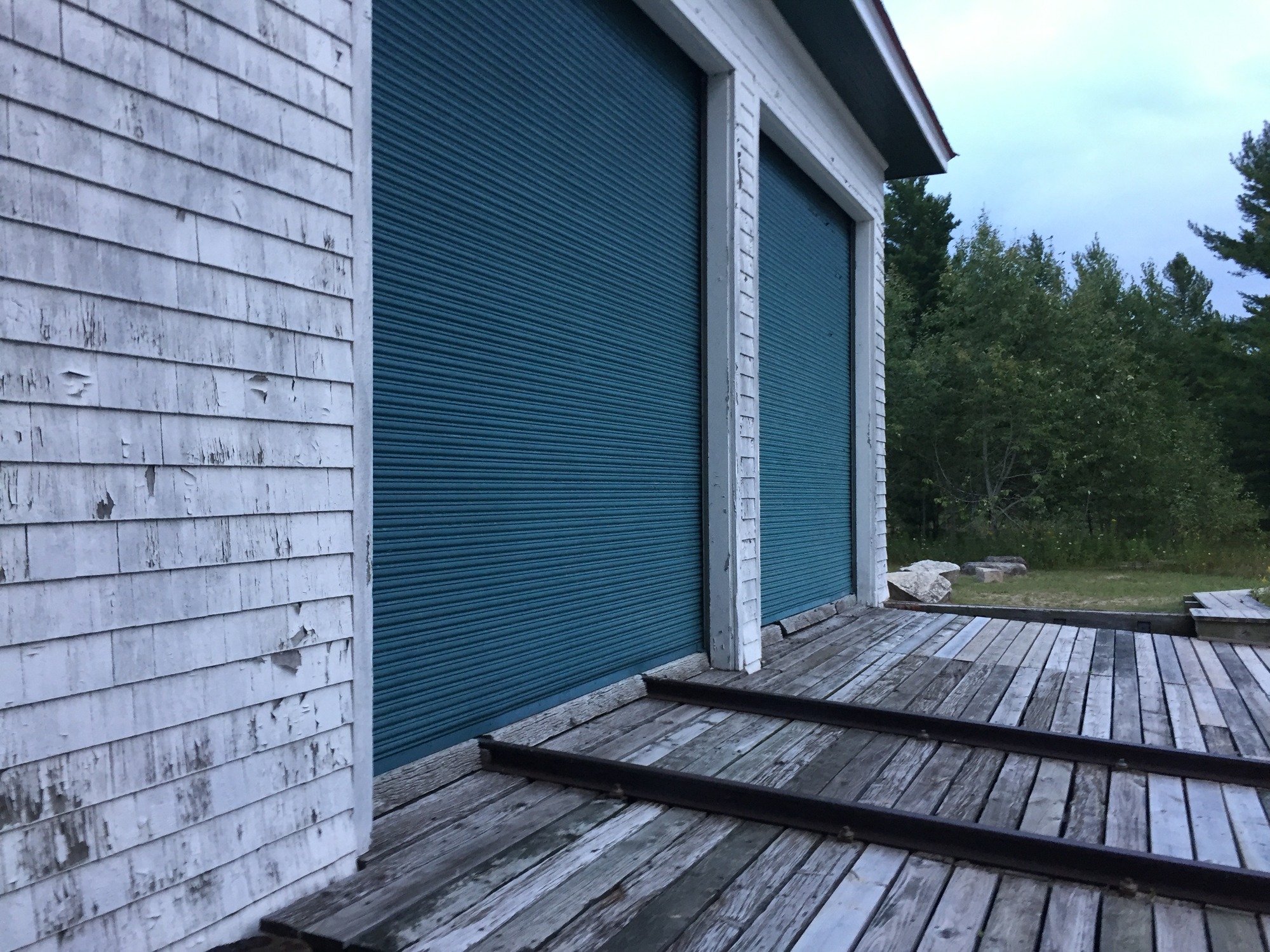 Many lifeboat stations were assigned rescue boats. Boats were stored in garages with doors opening to the water. Rails run from the boathouse into the water.