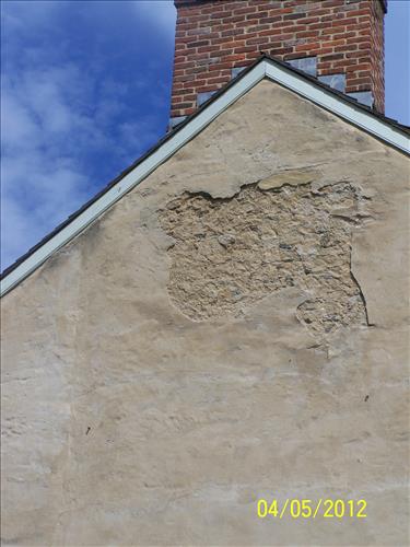 2012 - Views of the deteriorating stucco on the west elevation of the historic John Wilson Building #45 in Lower Town, Harpers Ferry, WV.