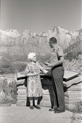 BW Photos of Superintendent Harold Grafe giving award to lady.