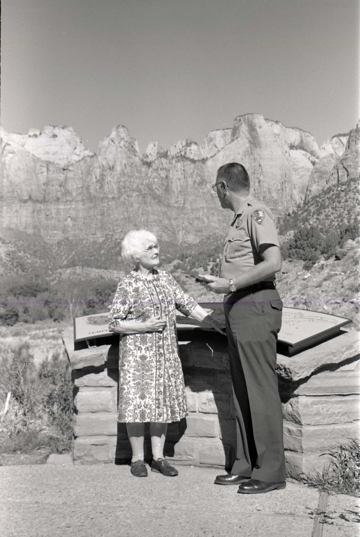 BW Photos of Superintendent Harold Grafe giving award to lady.