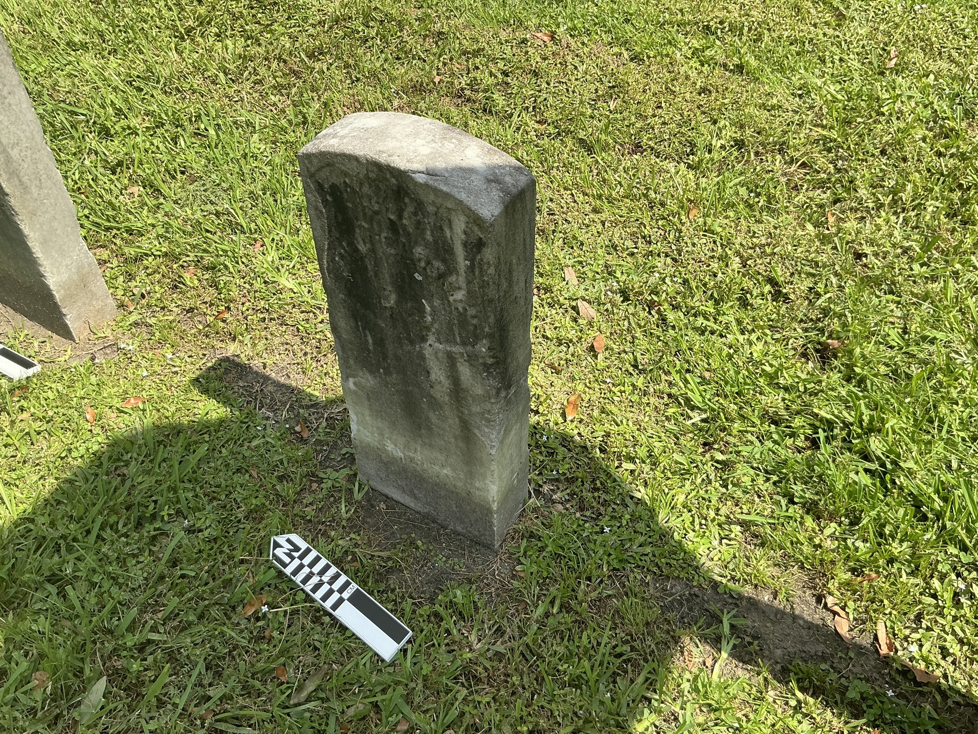 Extra image of historic upright marble headstone with recessed shield face.