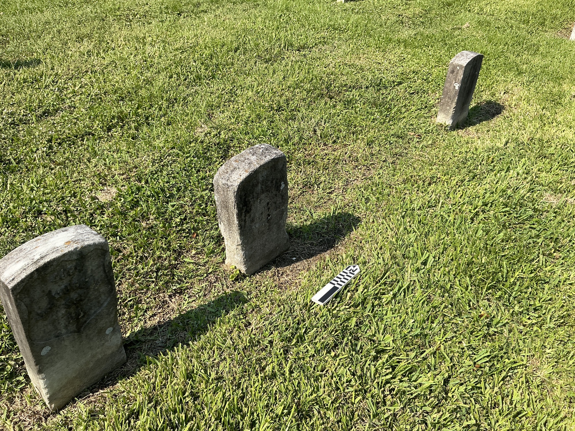 Extra image of historic upright marble headstone with recessed shield face.
