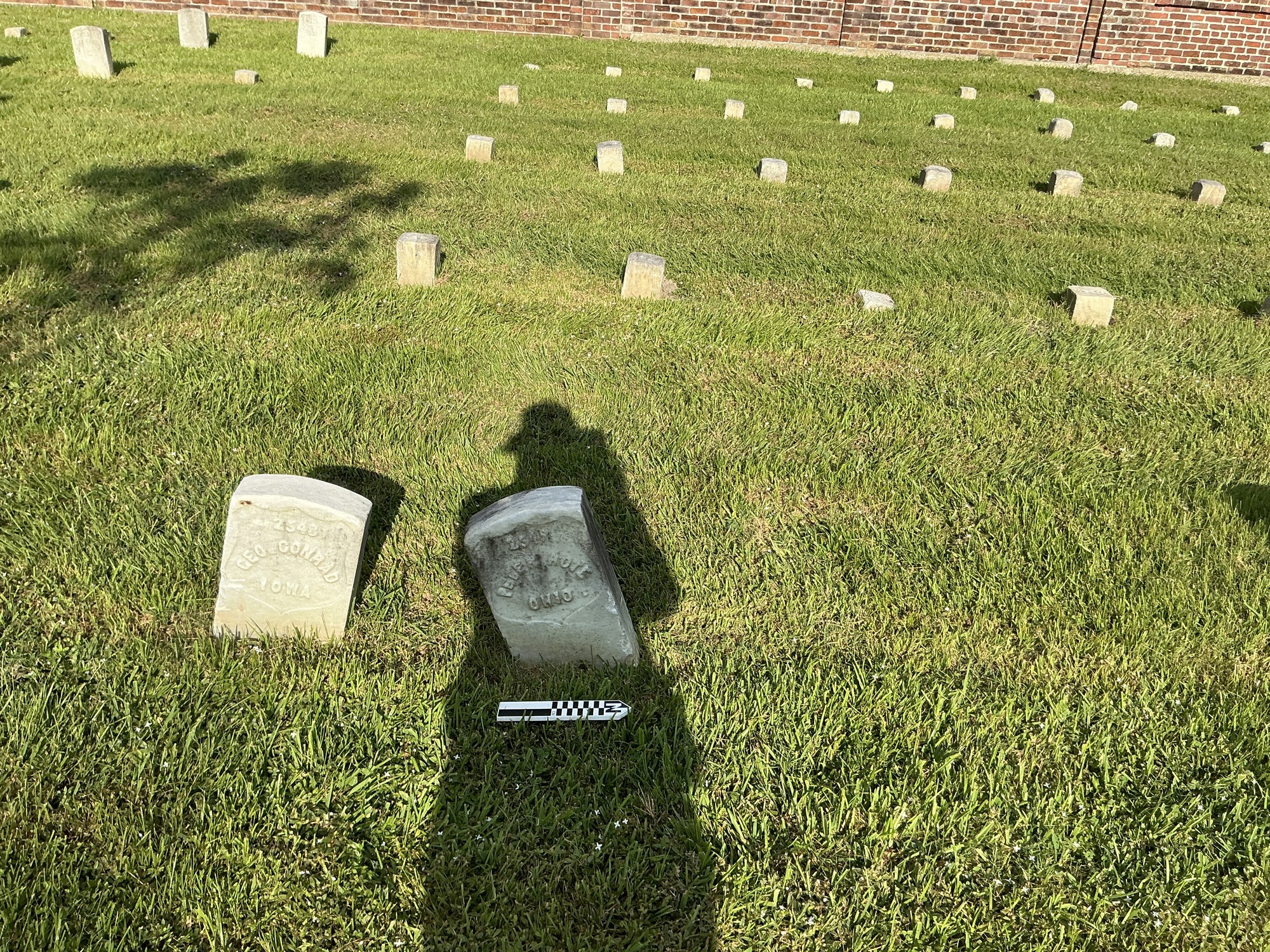 Extra image of historic upright marble headstone with recessed shield face.