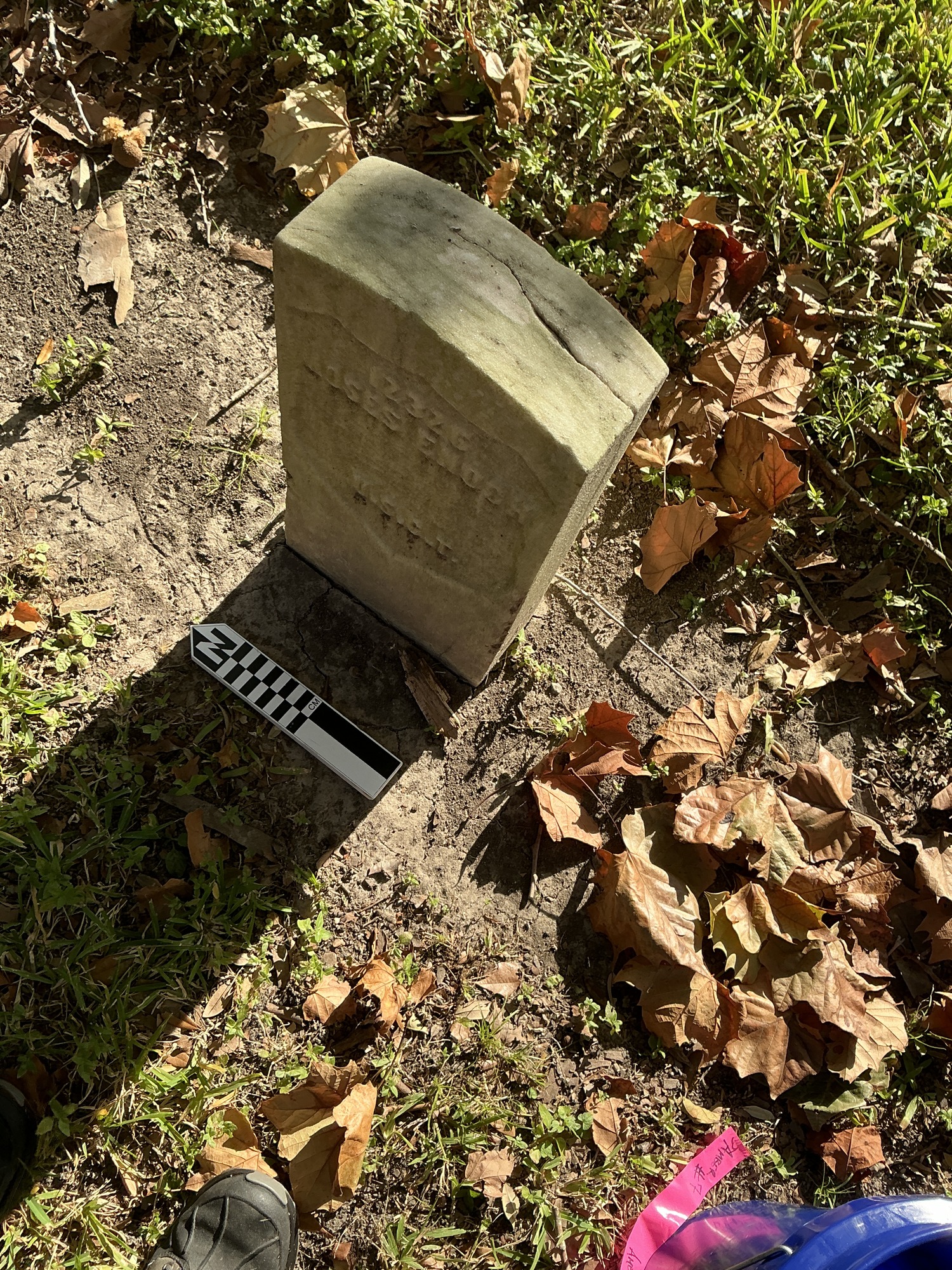 Extra image of historic upright marble headstone with recessed shield face.