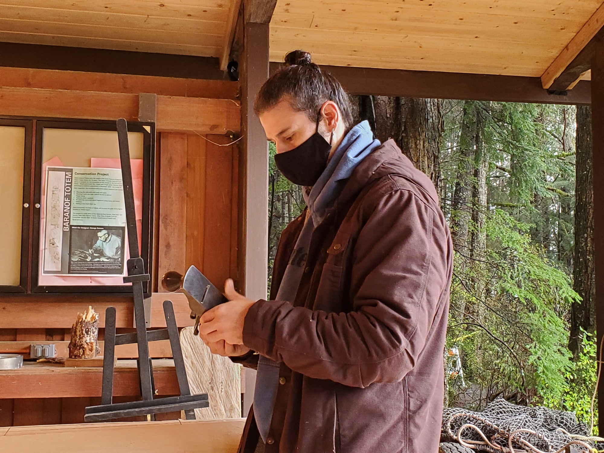 A man holds a Hand Plane carpentry tool. 