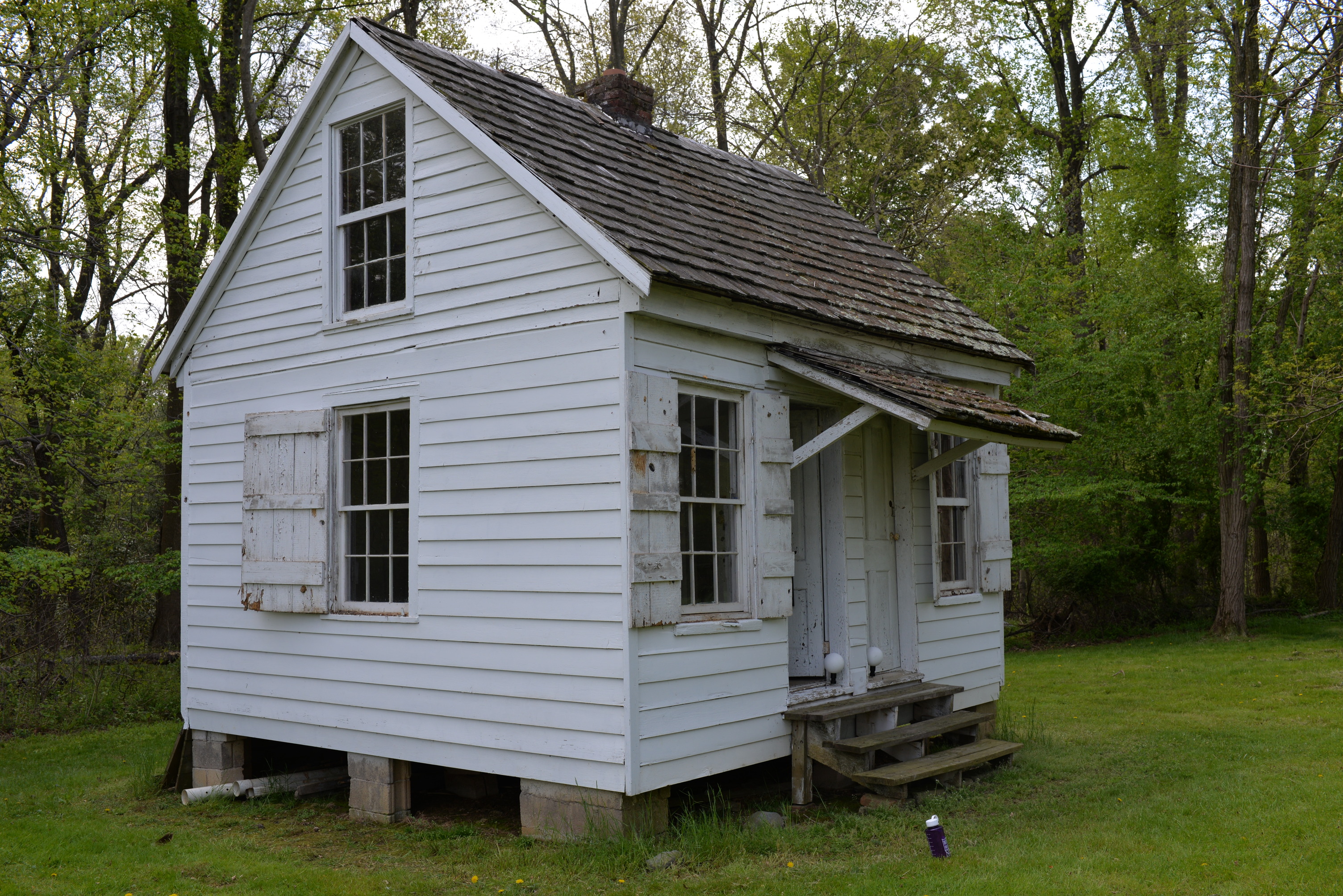 Wooden structure with centralized chimney.