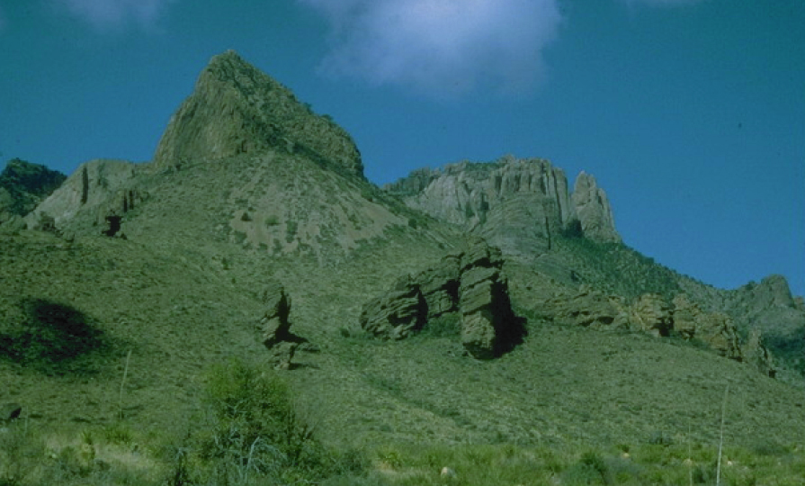 view looking up at rock cap on mountains