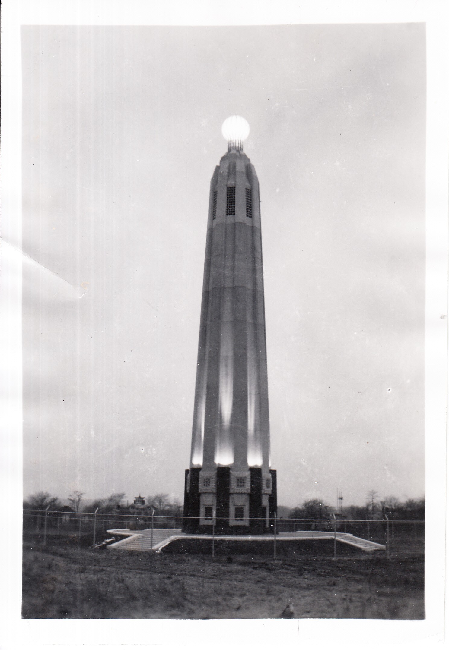 Edison Tower, Menlo Park, New Jersey, with model of incandescent lamp illuminated.