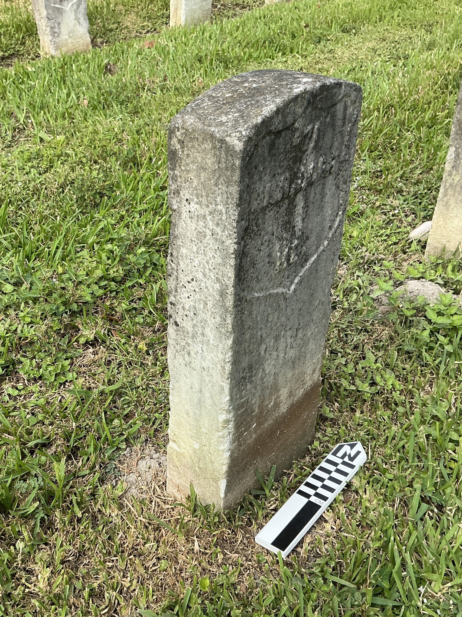 Extra image of historic upright marble headstone with recessed shield face.