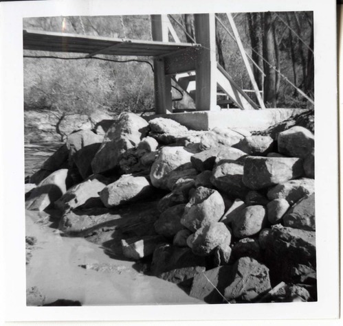 Protection/stabilization of the footings for the old Birch Creek suspension footbridge.