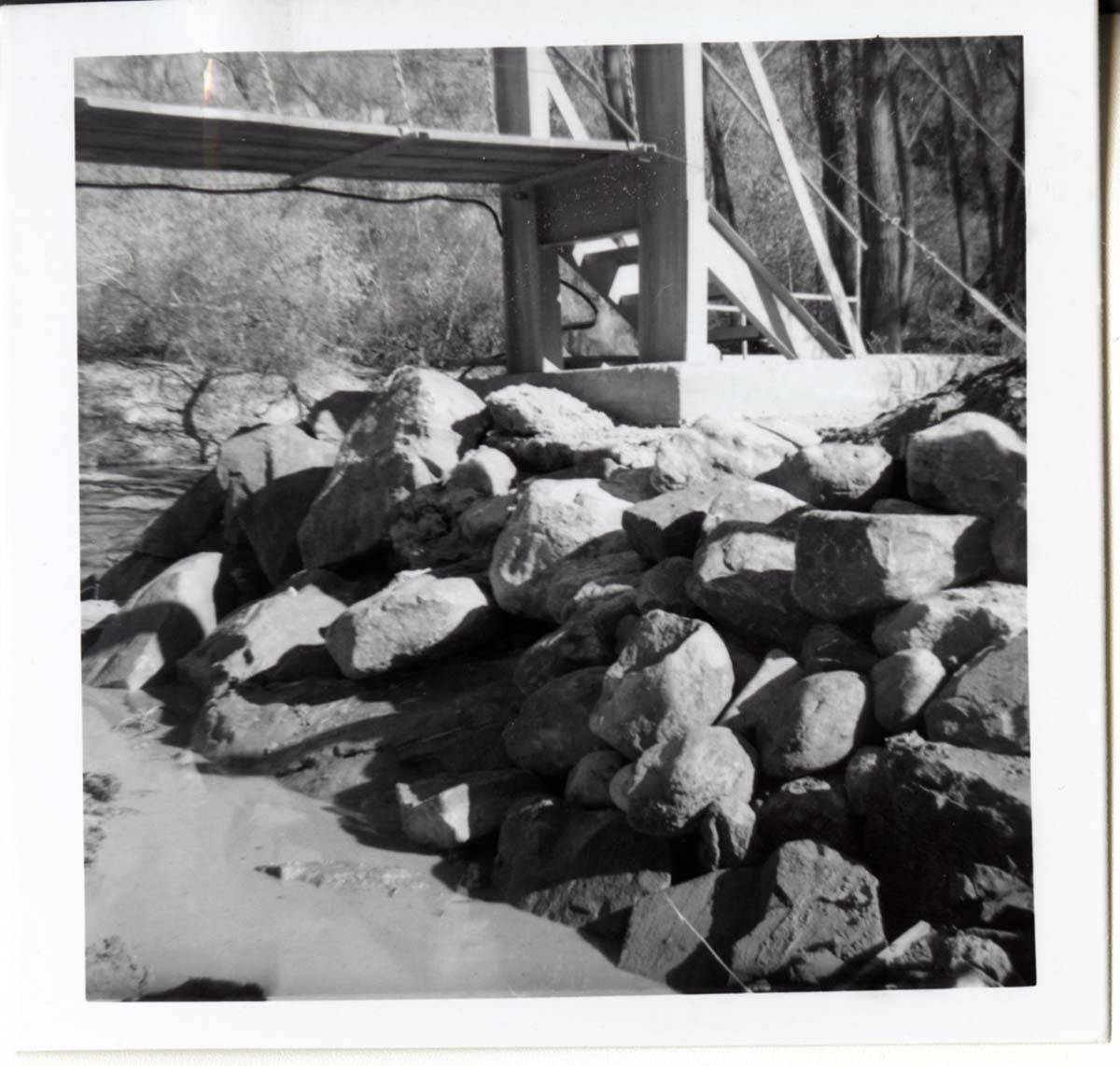 Protection/stabilization of the footings for the old Birch Creek suspension footbridge.
