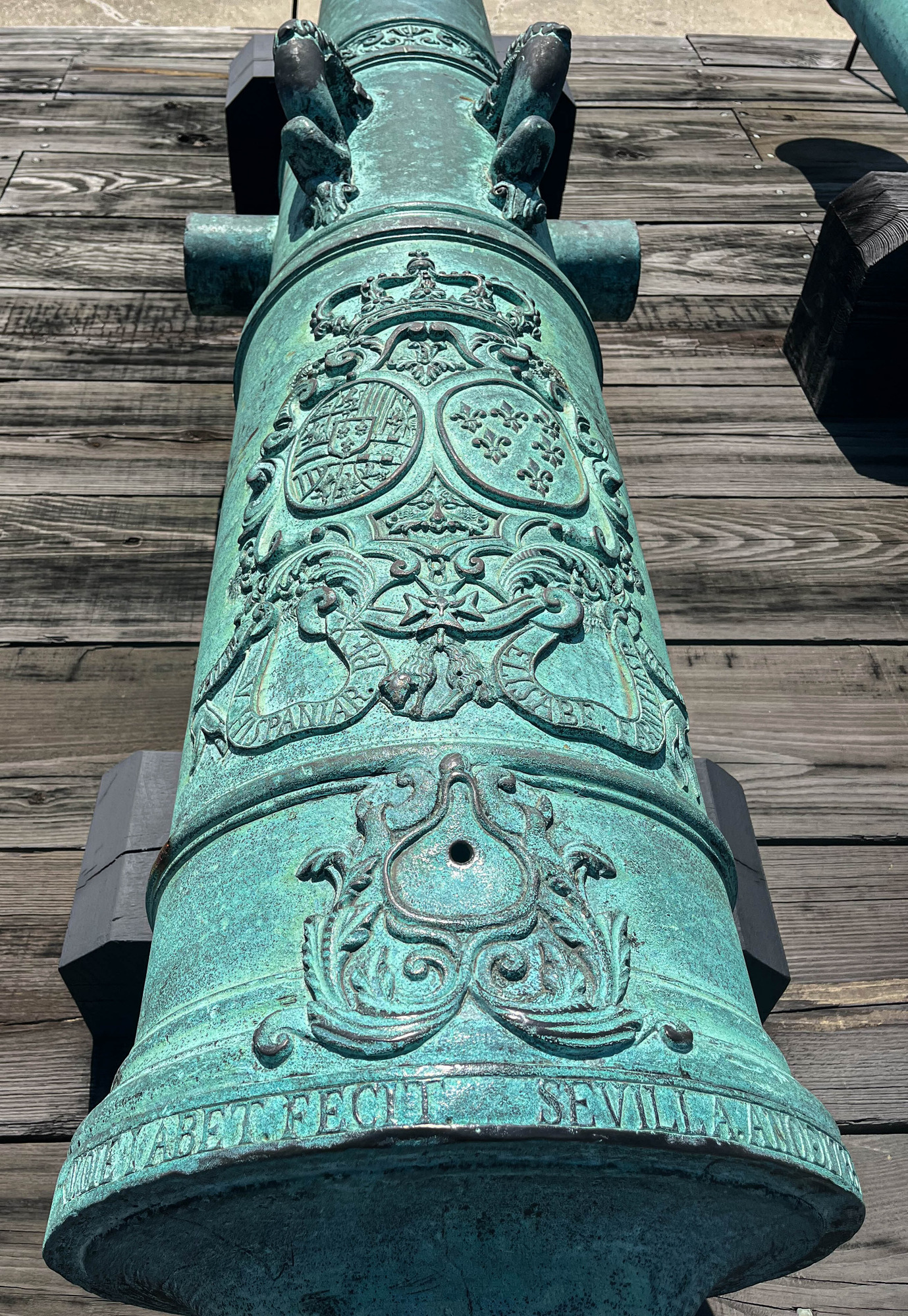 The barrel of an elaborately detailed historic Spanish cannon 
