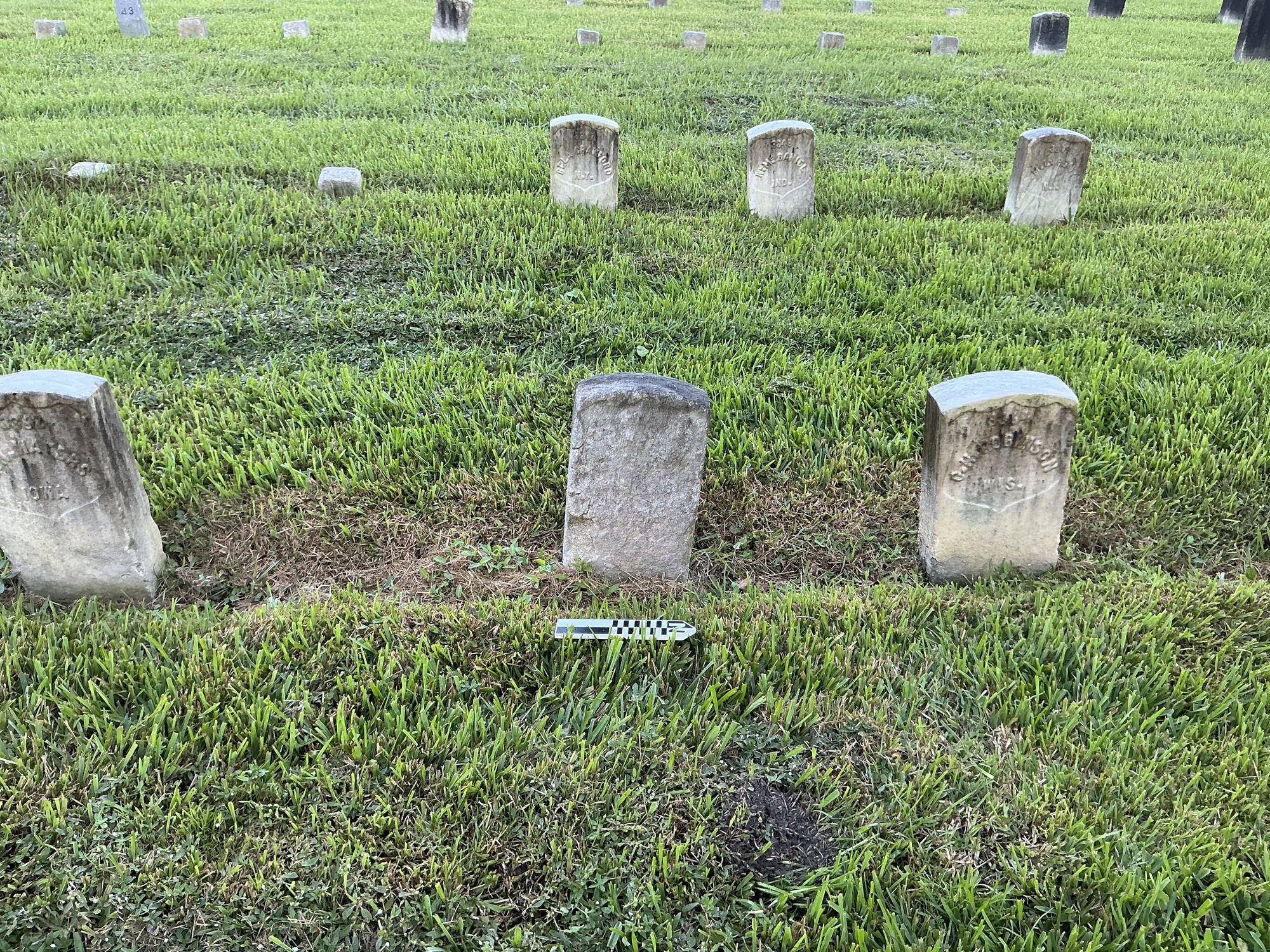 Extra image of historic upright marble headstone with recessed shield face.