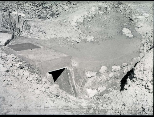Irrigation ditch, west bank of Virgin River, 200 yards north of bridge. Concrete protection of water flume, and man-hole for clean out.