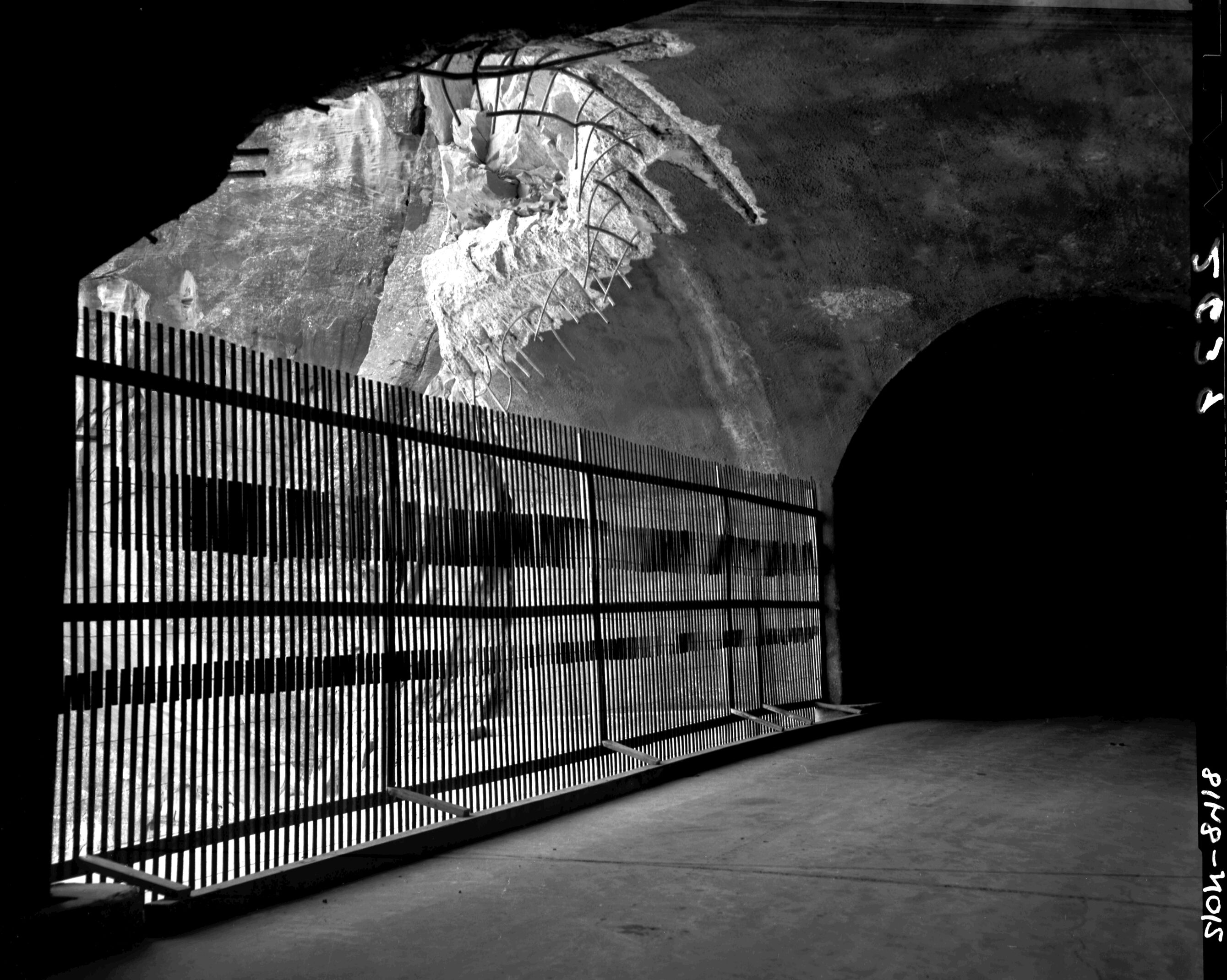 B&W negative of rock fall in Zion-Mt. Carmel Highway tunnel portal. [second image and positive; writing on original nitrate]
