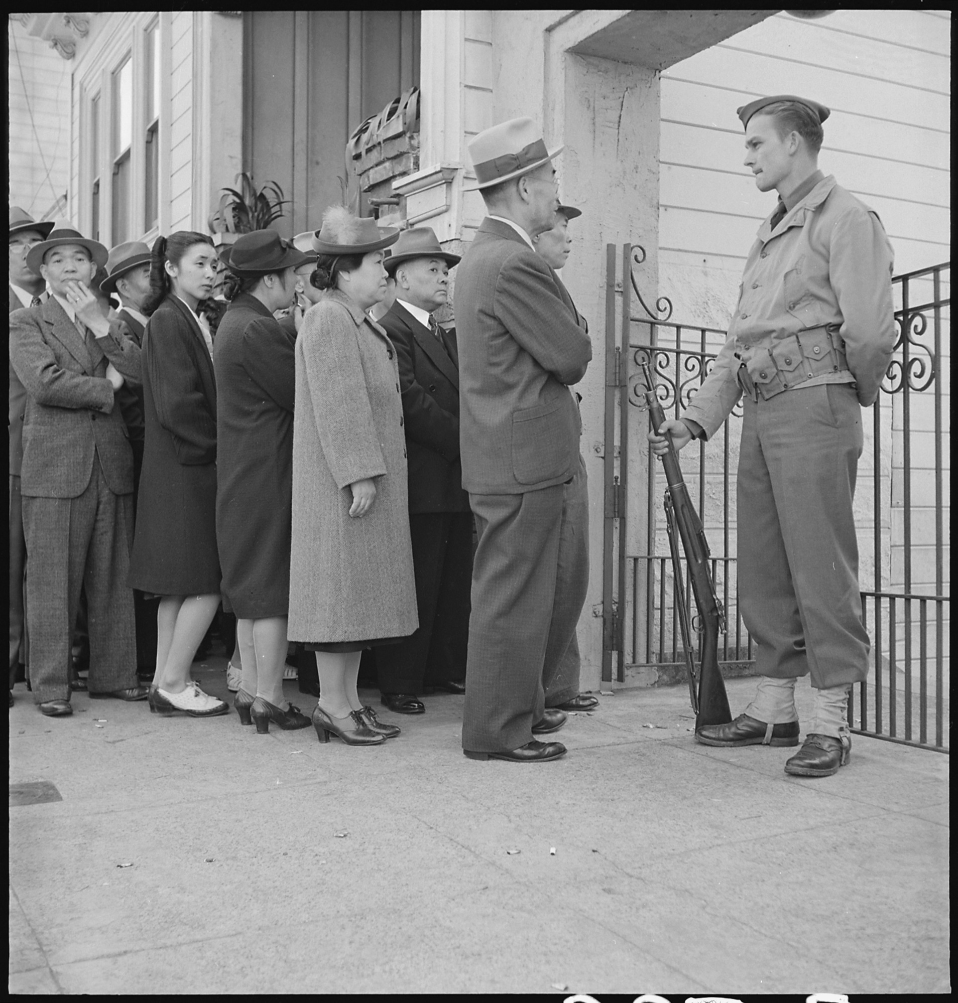 San Francisco, California. Bush Street, San Francisco. Japanese family heads and persons living alone form a line outside Civil Control station located in the Japanese American Citizens League Auditorium at 2031 Bush Street, to appear for "processing" in response to Civilian Exclusion Order Number 20