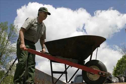 RiverDay trash clean up staff and volunteers at dumpster