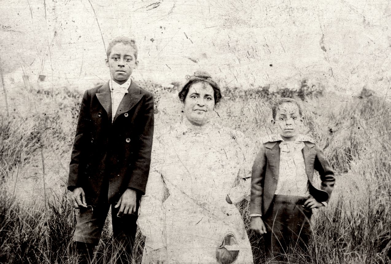 Maggie Walker with sons Russell and Melvin in a field
