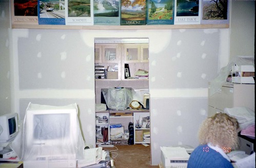 Construction of headquarters addition Image of woman working at desk during the construction of headquarters addition.