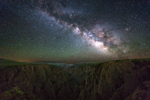 Milky Way arcs over canyon