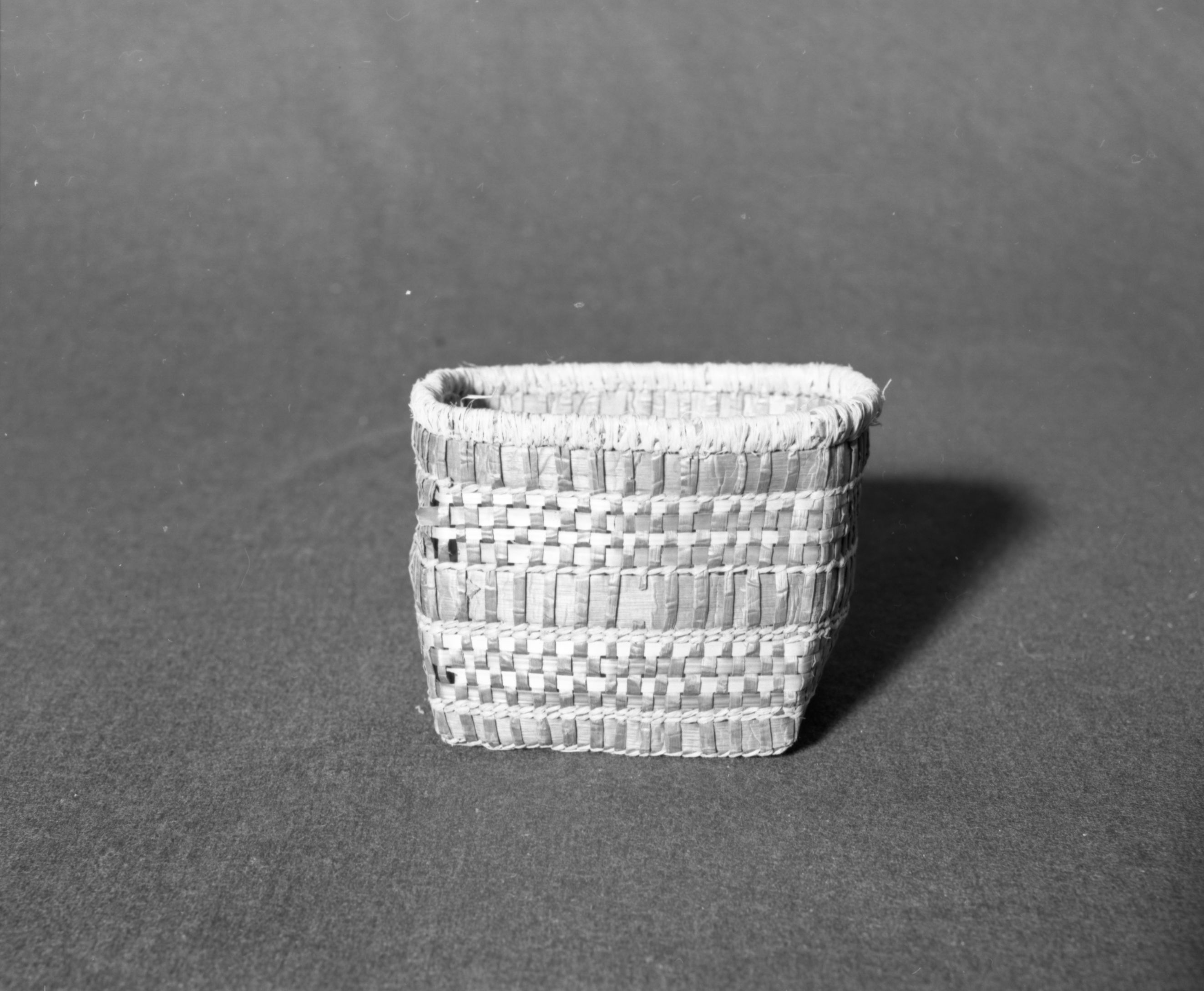 Marie Rozier Collection, Catalog No. 14. Object: Makah basket. Dimensions: 5 1/2 diameter x 4 1/2 x 4 1/2 height. Materials: Red cedar, raffia, beargrass. Collection History: Gift of G. DuGay. Photographed by Michael Dixon in December 1982. Catalogued by Craig Bates and Barbara Beroza. Yosemite Collections, National Park Service.