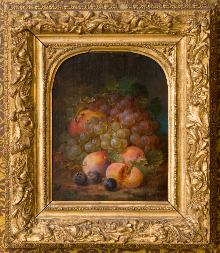 Still life of bunches of grapes and four peaches