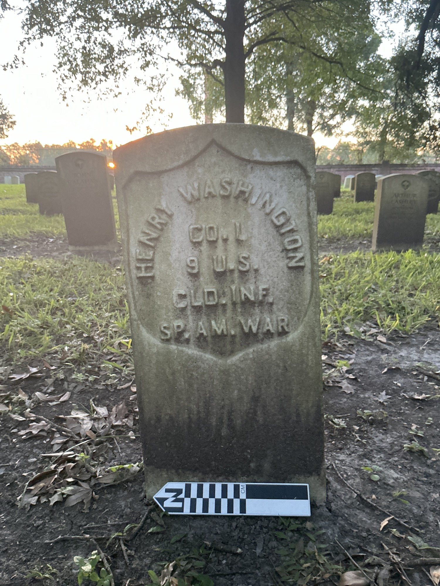 Extra image of historic upright marble headstone with recessed shield face.