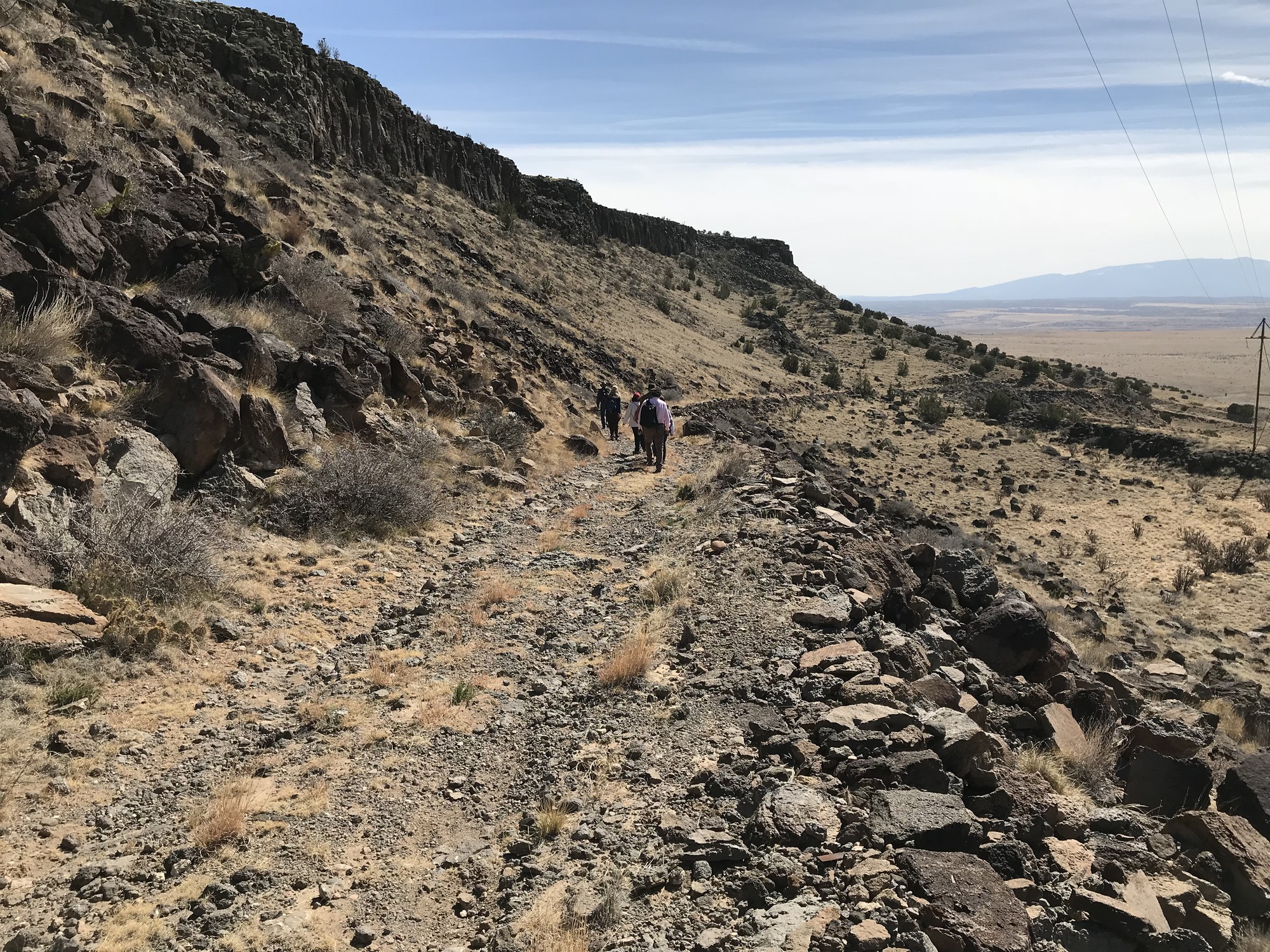 A group walks the trail down La Bajada Mesa outside of Santa Fe, NM
