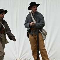 Confederate soldiers holding their muskets.
