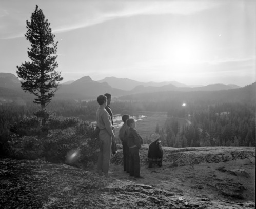 Visitors watching sunset at Tuolumne Meadows from Puppy Dome.