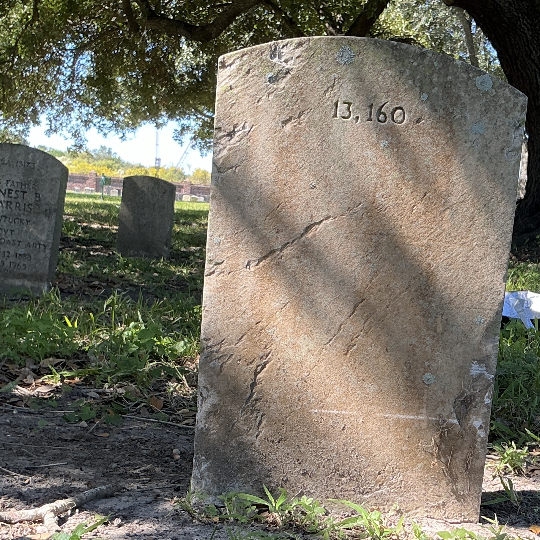 Back of upright marble headstone with flat face.