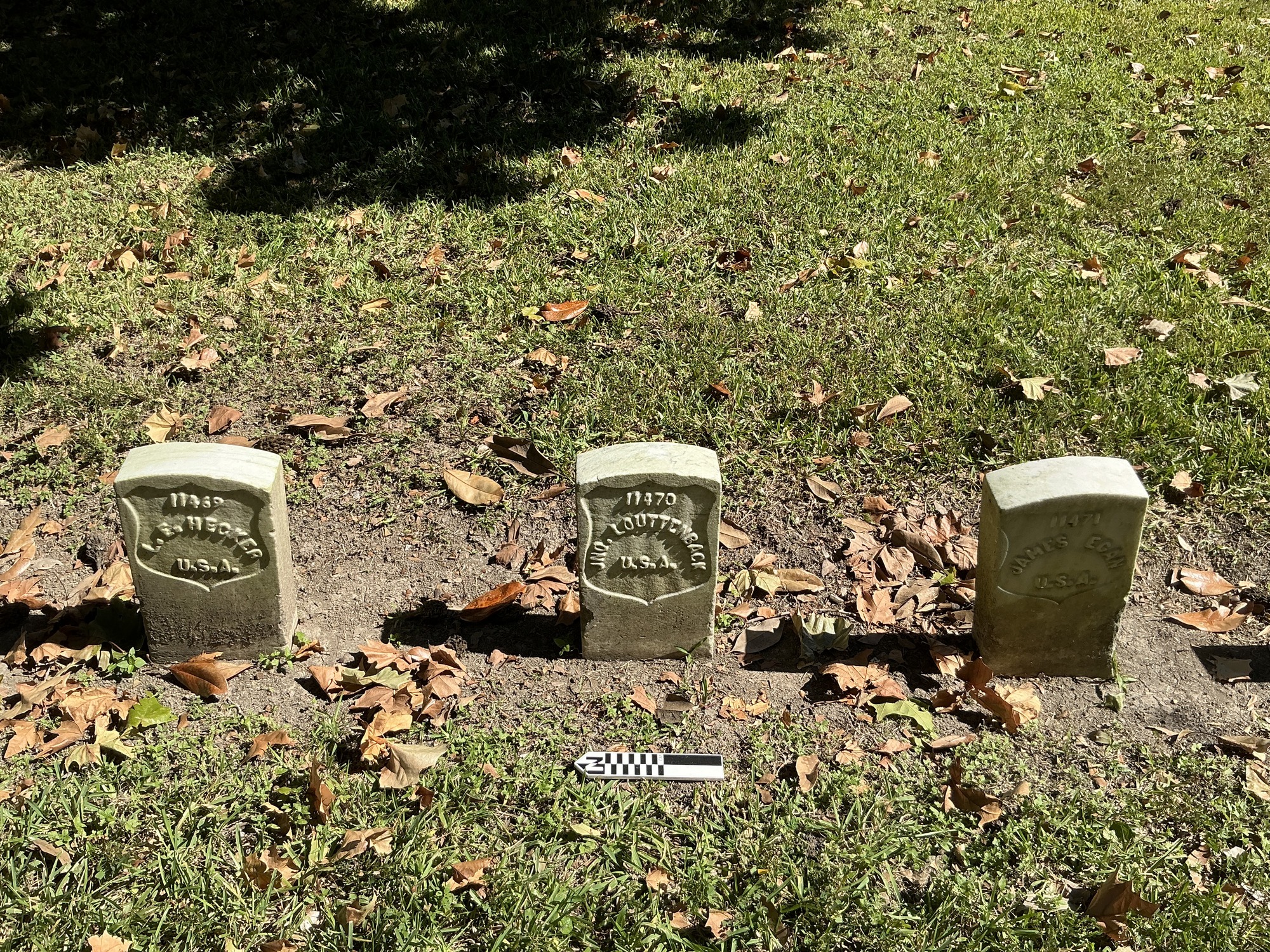 Extra image of historic upright marble headstone with recessed shield with recessed lettering face.
