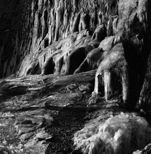 Weeping Rock covered in ice in winter.