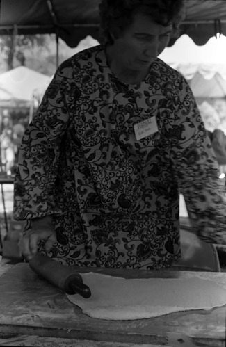 Woman rolling dough for scones (fry bread) demonstration. Second annual Folklife Festival, Zion National Park Nature Center on September 7-8 1978.