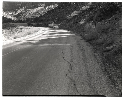 Crack in road in need of repair along the Zion-Mt. Carmel Highway switchbacks.